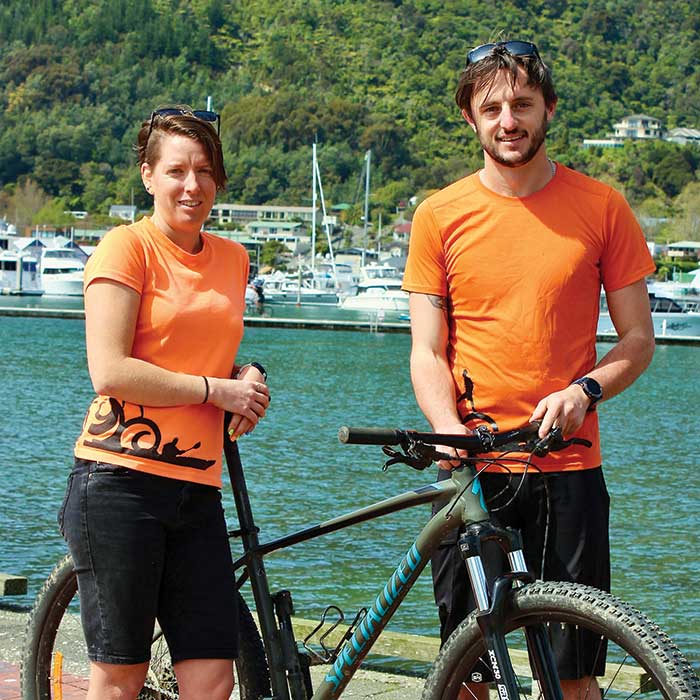 Owners Aaron and Nat pose with Mountain bike on the Picton foreshore